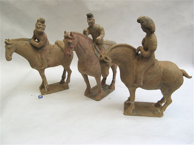 Appraisal: THREE CHINESE POTTERY ARCHAIC STYLE MOUNTED MEN on Tang style