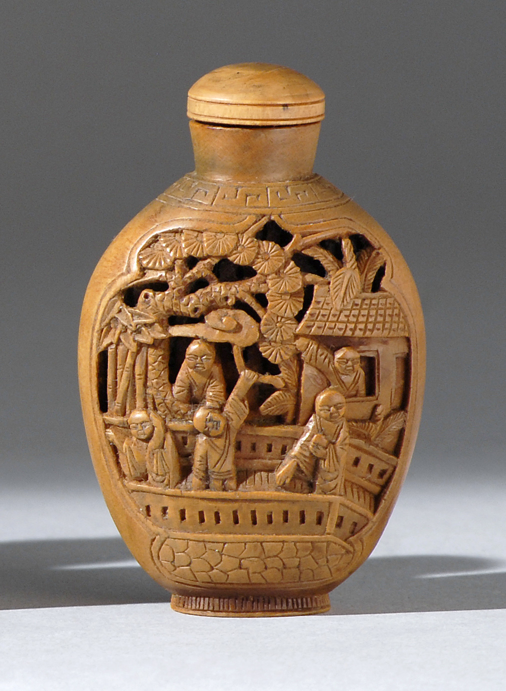 Appraisal: CARVED WOOD SNUFF BOTTLE th CenturyIn spade shape with sunken-relief