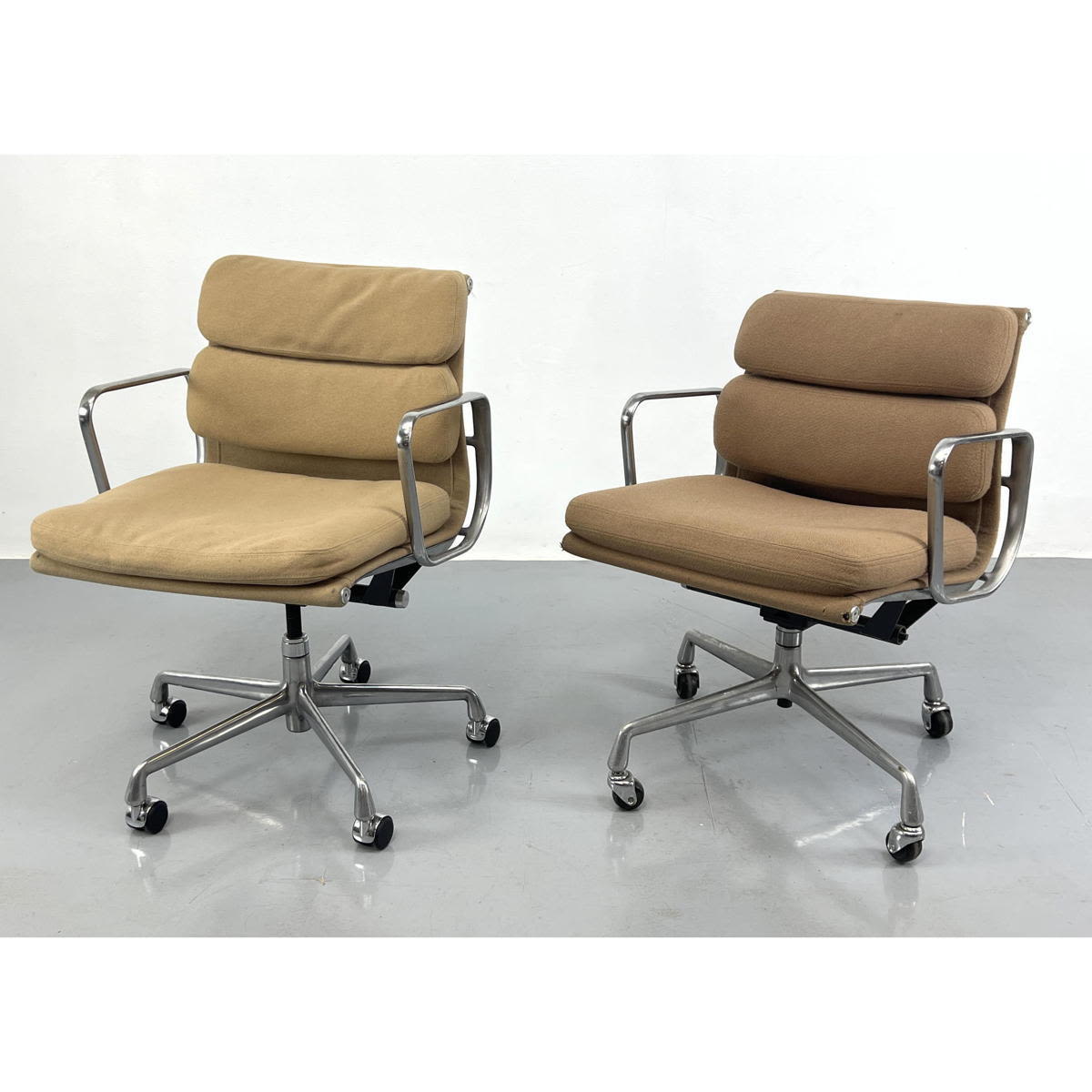 Appraisal: Pair Charles Eames Aluminum Group Chairs Tan fabric Eames Soft