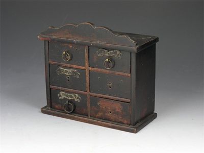 Appraisal: A stained wood spice chest of six drawers and with