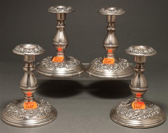 Appraisal: Set of four American weighted repousse silver low candlesticks S