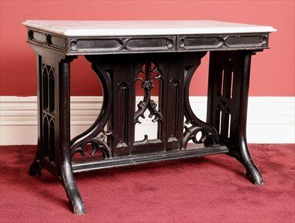 Appraisal: GOTHIC REVIVAL CARVED AND EBONIZED OAK MARBLE-TOP CENTER TABLE AFTER