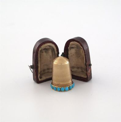 Appraisal: A Victorian gold thimble unmarked with a border of turquoise