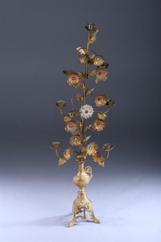 Appraisal: CONTINENTAL GILT-METAL SEVEN-LIGHT CANDELABRUM late th century Gem encrusted flowerheads