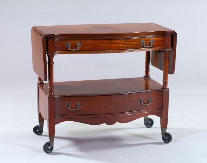 Appraisal: Regency-Inspired Mahogany Drop-Leaf Serving Trolley the serpentine top with two