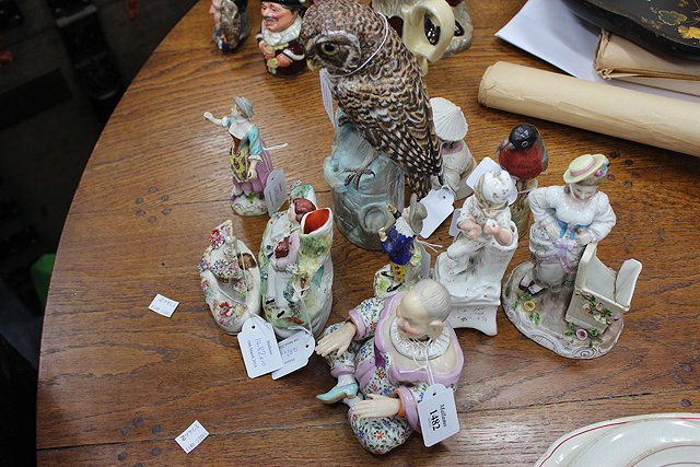 Appraisal: A QUANTITY OF CONTINENTAL PORCELAIN FIGURES to include a seated