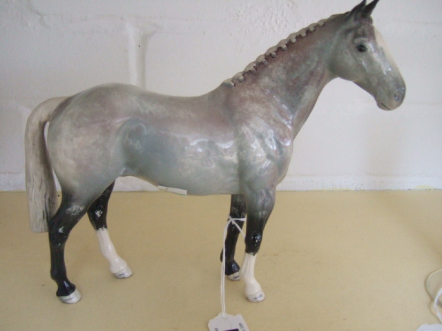 Appraisal: A Beswick horse modelled as a hunter grey colouring Illustrated