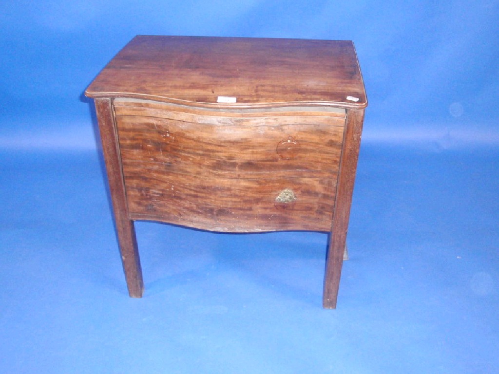 Appraisal: A Georgian mahogany serpentine box commode