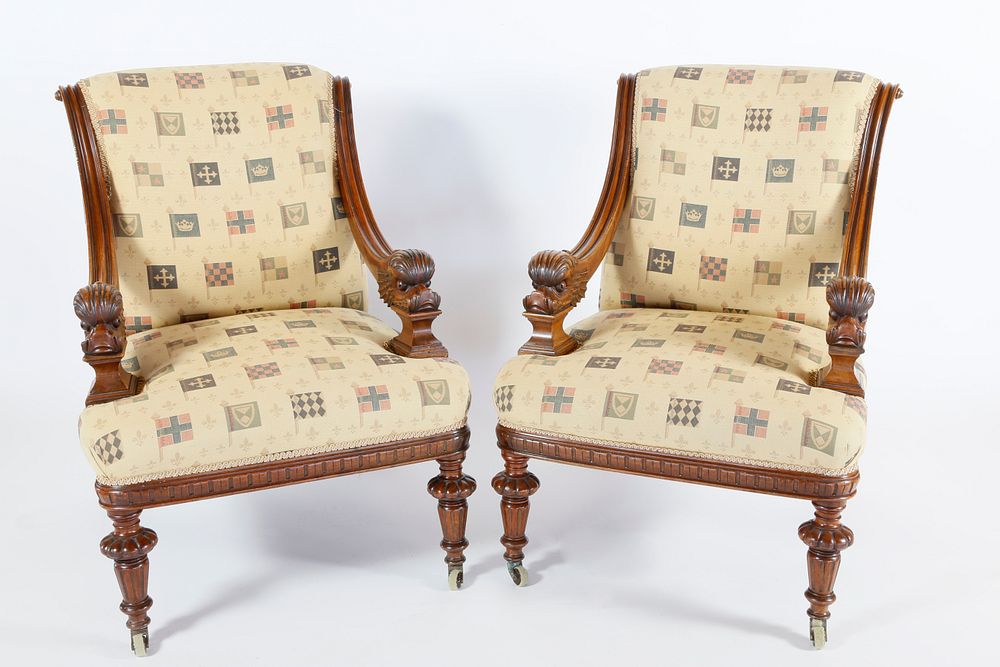 Appraisal: Pair of Mahogany Upholstered Library Chairs with Carved Dolphin Arm-grips