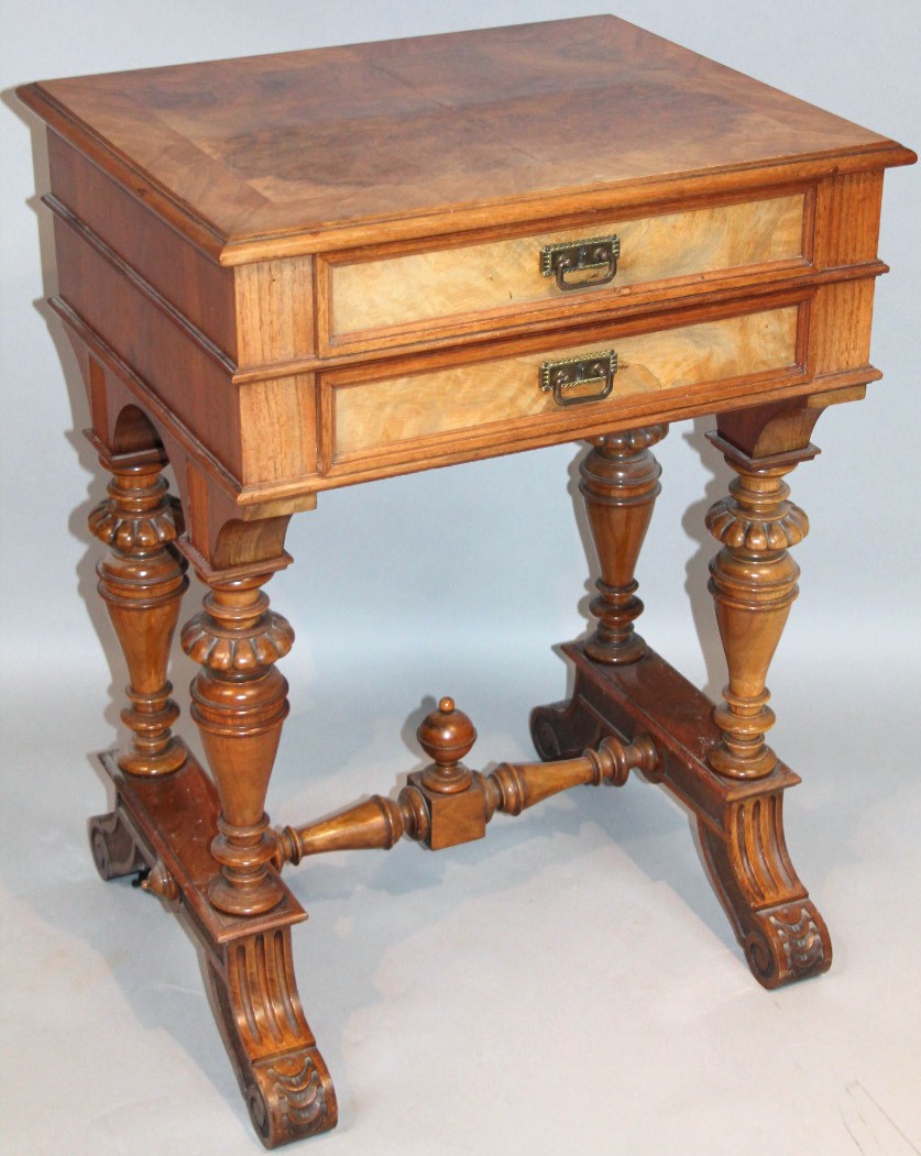 Appraisal: An early Edwardian walnut sewing table the rectangular moulded overhanging