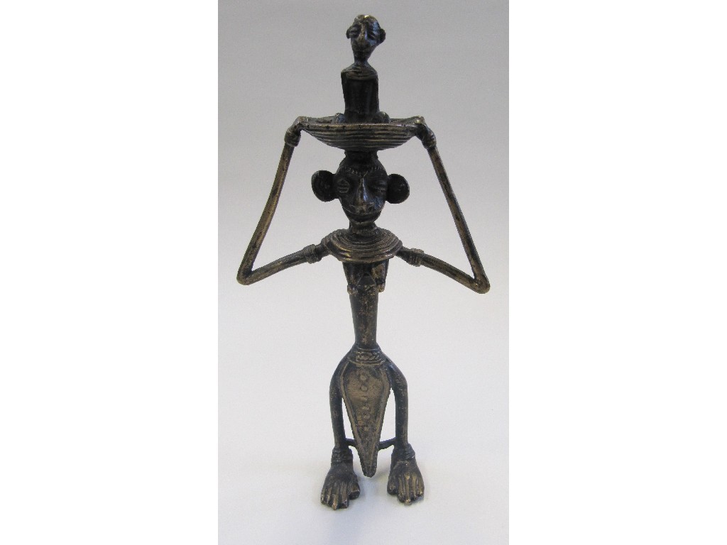 Appraisal: Bronze tribal figure of a woman carrying a child in