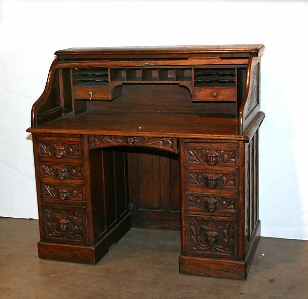 Appraisal: A Renaissance Revival style oak roll top desk late th