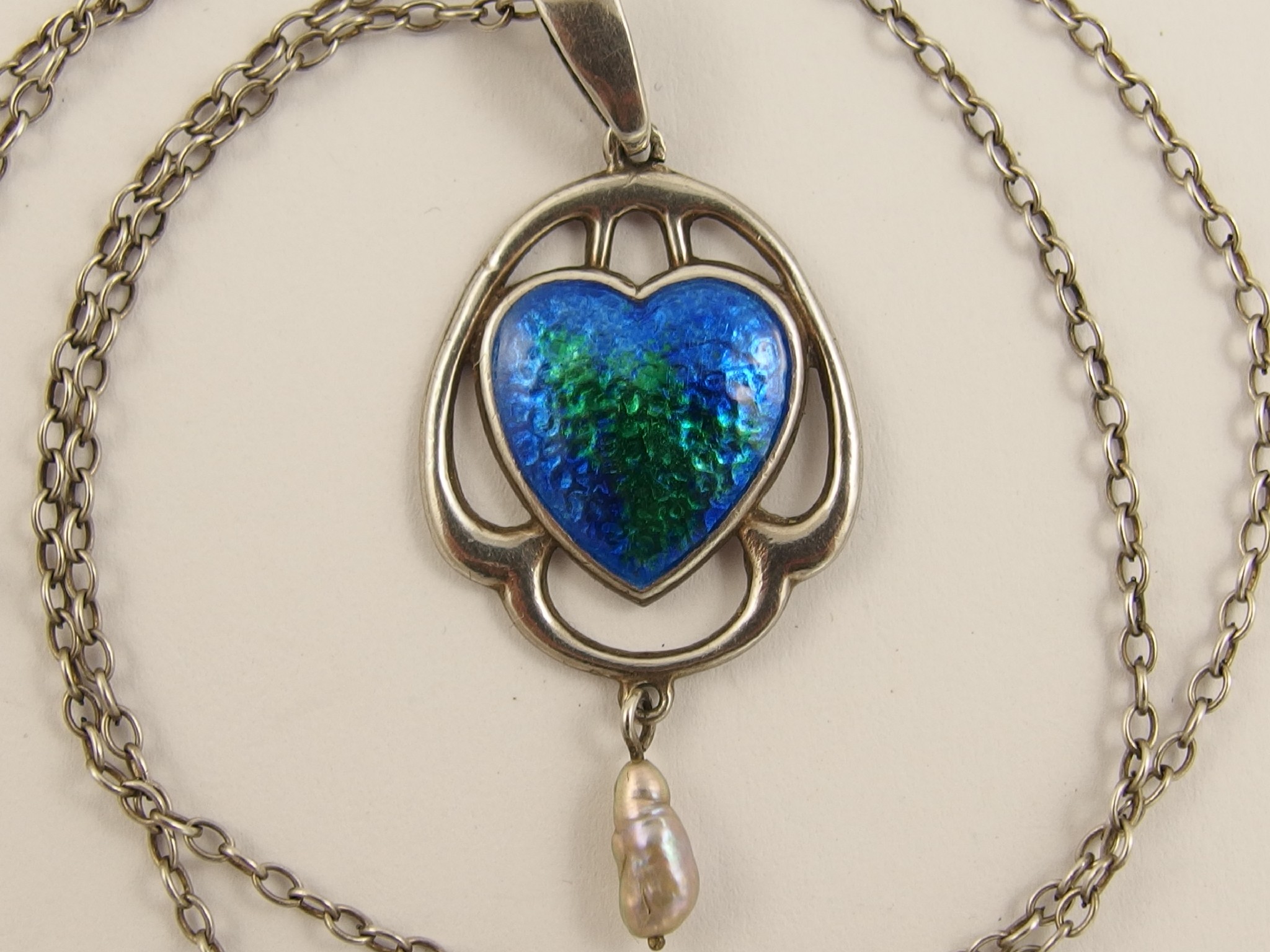 Appraisal: An enamelled Charles Horner pendantthe heart shape enamelled in blue