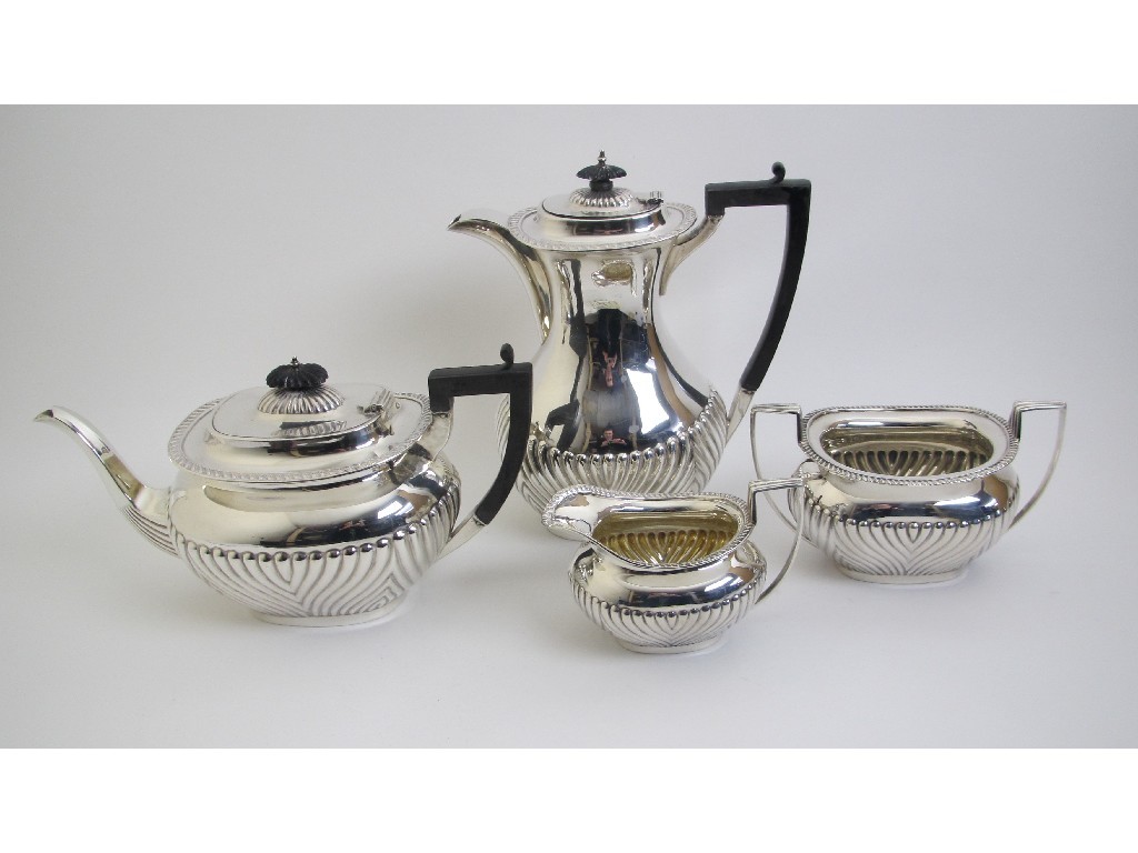 Appraisal: A silver four piece tea service with lobed sides Sheffield