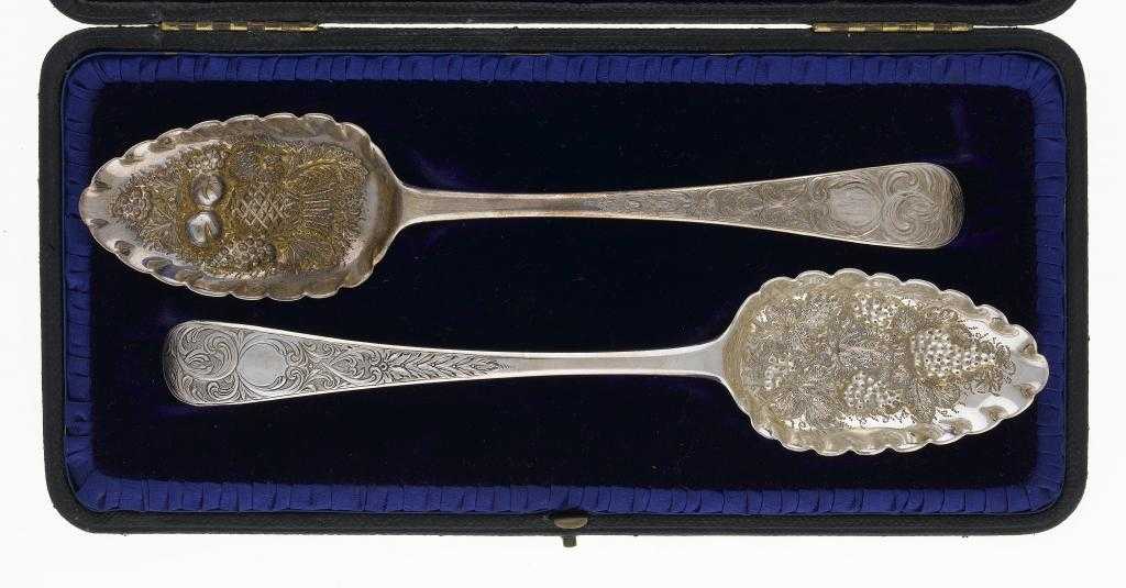 Appraisal: A PAIR OF GEORGE III TABLESPOONS later chased as 'berry'