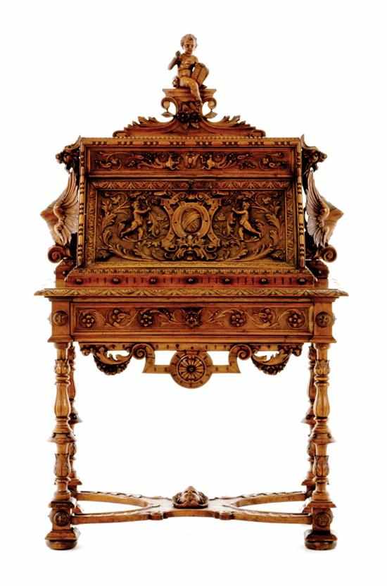 Appraisal: Unusual Continental highly carved walnut secretary th century carved putti