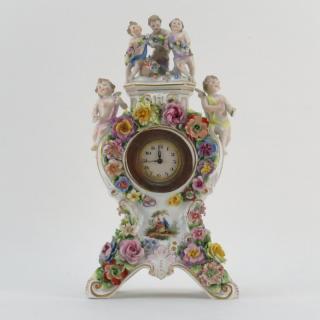 Appraisal: Meissen Style Porcelain Figural Clock Signed Losses to wings flower