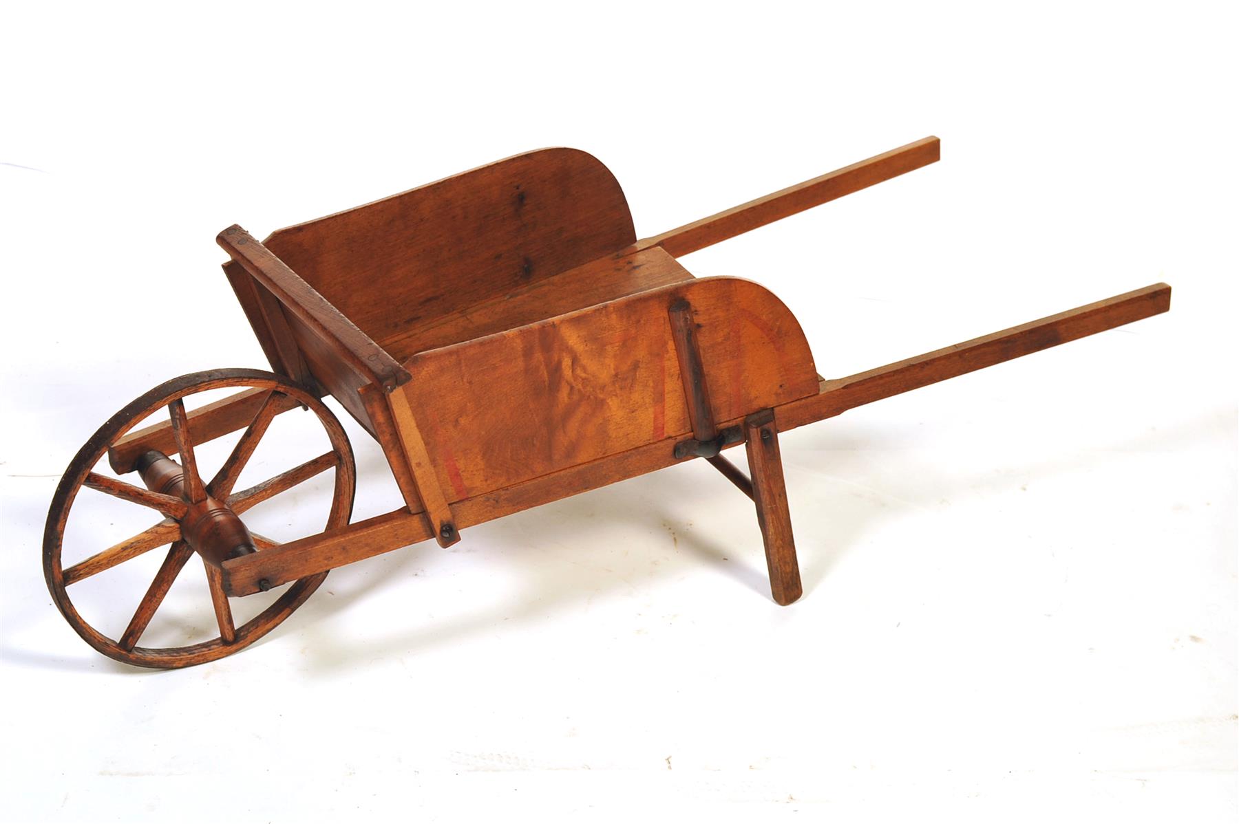 Appraisal: CHILD'S SIZE WHEELBARROW American ca mixed woods Removable side slats