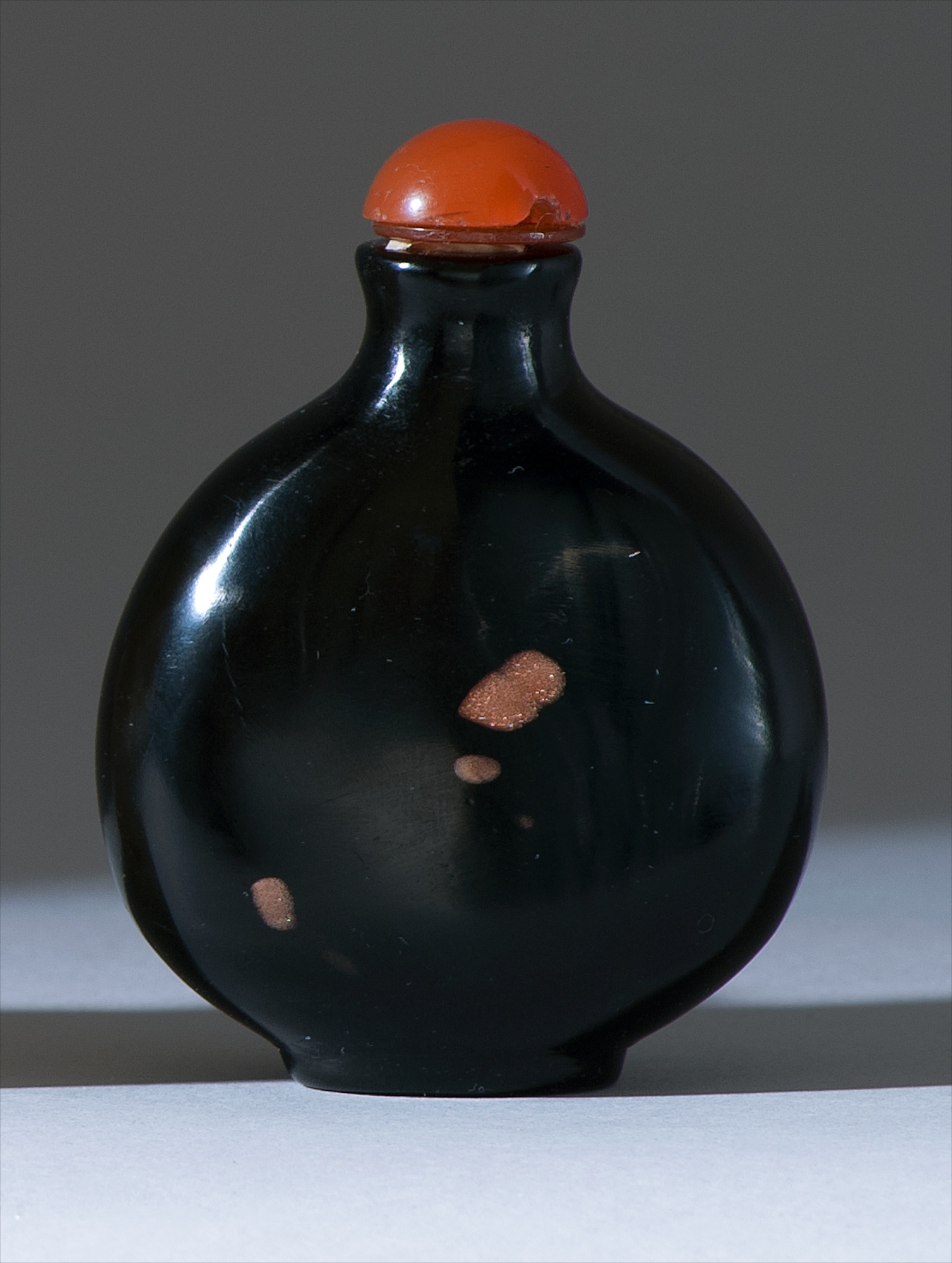 Appraisal: GLASS SNUFF BOTTLE Circa In flattened ovoid form with aventurine