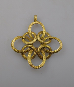 Appraisal: ct textured yellow gold open knot style pendant approx g