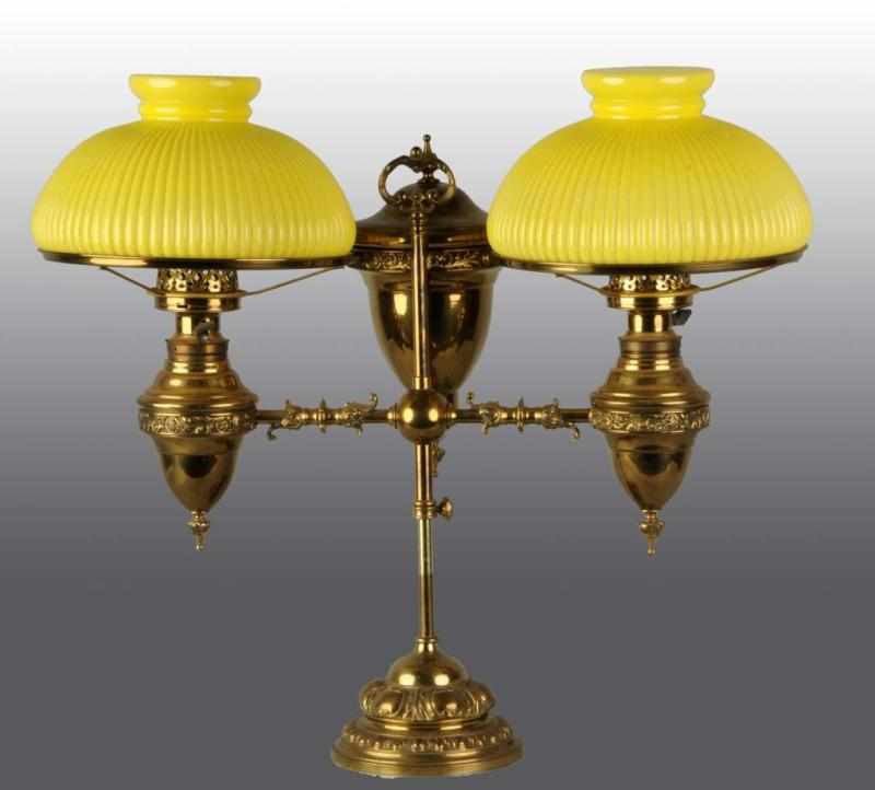 Appraisal: Double Brass Student Lamp Description With large kerosene canister and