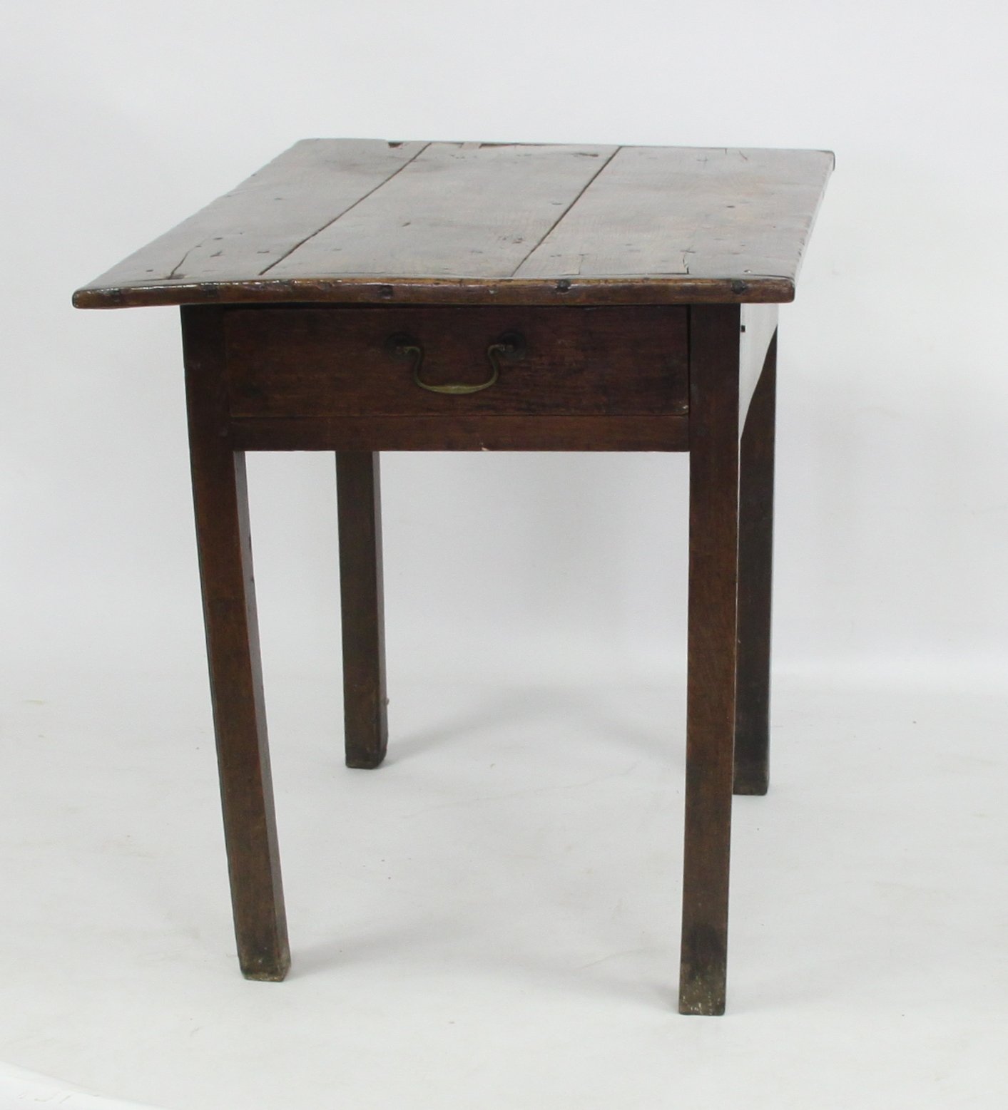 Appraisal: A George III oak side table the planked top above