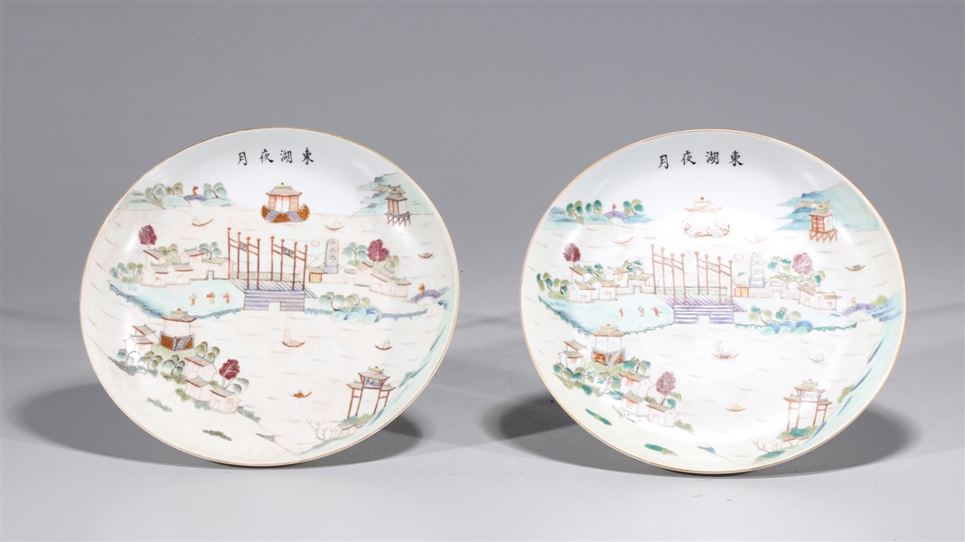 Appraisal: Two Chinese famille rose plates each with river scenes and