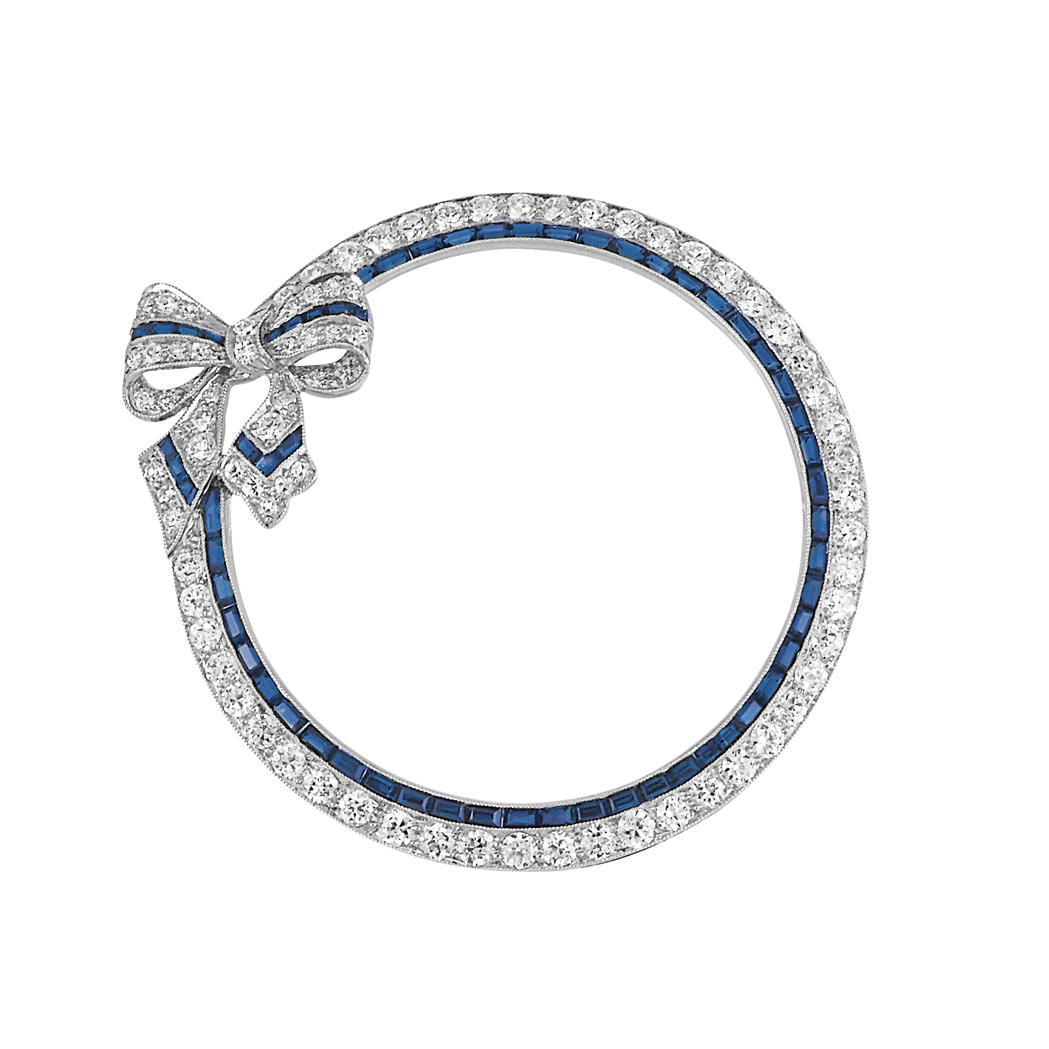 Appraisal: Platinum Diamond and Sapphire Circle Bow Brooch diamonds ap cts