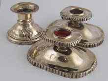 Appraisal: A pair of continental dwarf silver candlesticks German assay marked