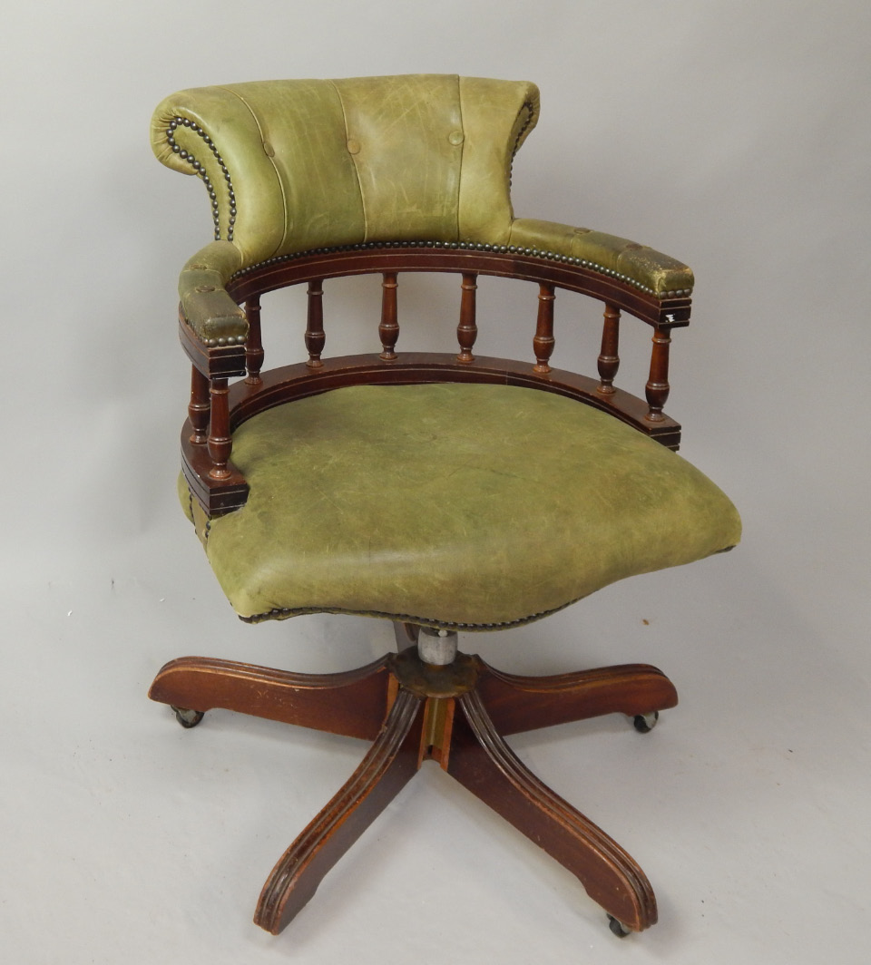 Appraisal: A reproduction green leather desk chair