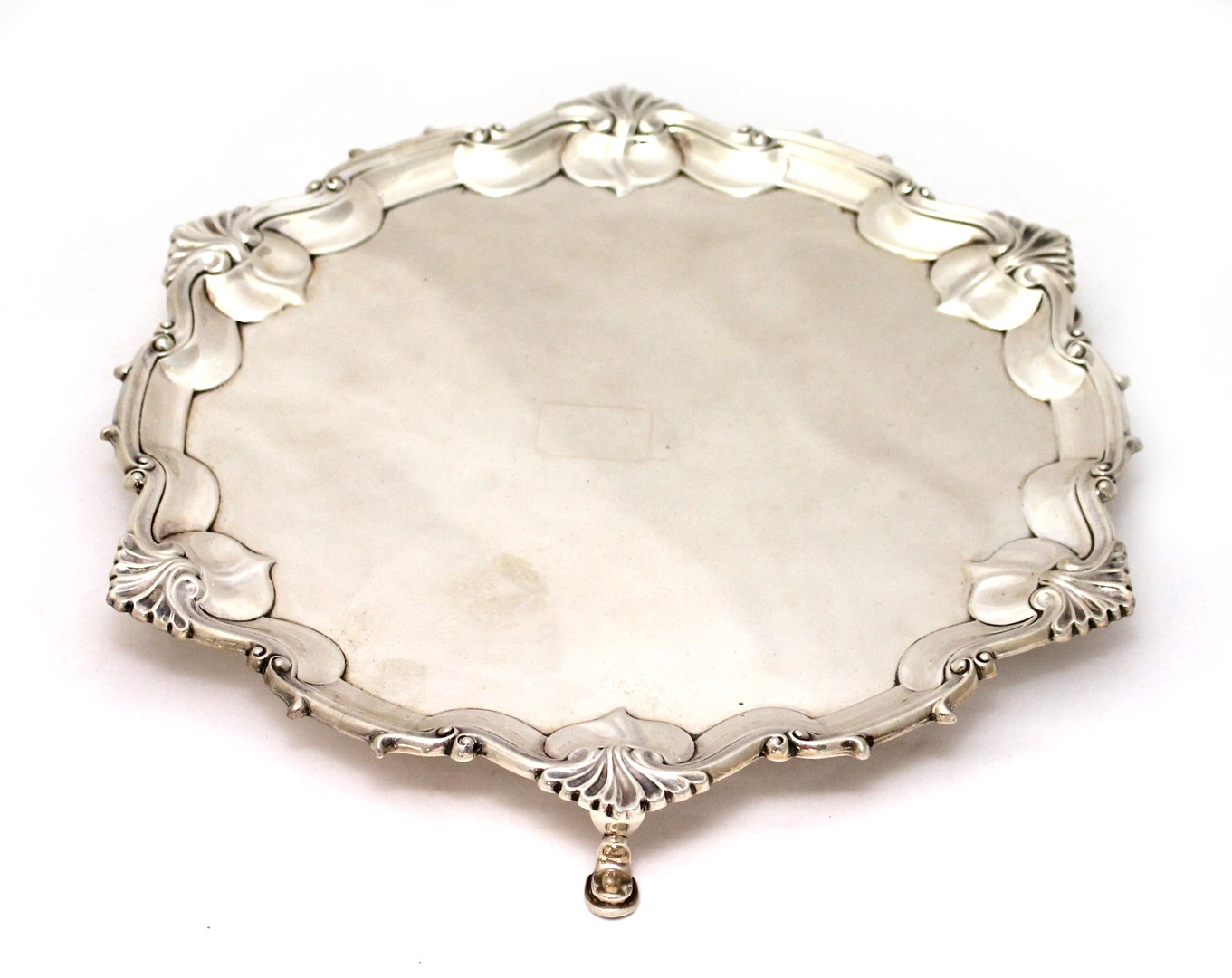 Appraisal: A silver shaped circular salver with a Chippendale style pie-crust