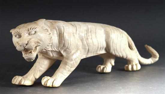 Appraisal: Japanese carved ivory tiger figure early th century figure of