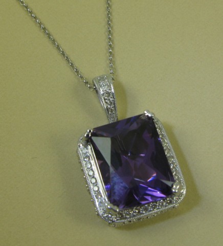 Appraisal: AMETHYST AND DIAMOND PENDANT NECKLACE with appraisal The pendant suspended