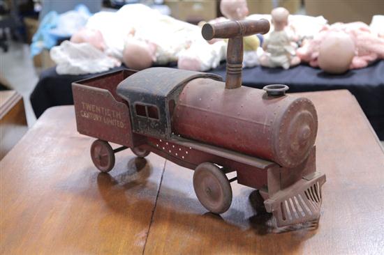 Appraisal: TIN RIDE-ON TRAIN TOY American th century Riding toy stenciled