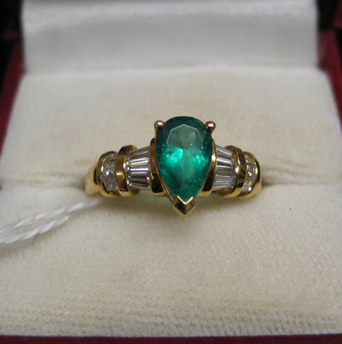 Appraisal: EMERALD DIAMOND AND EIGHTEEN KARAT GOLD RING Centered and prong