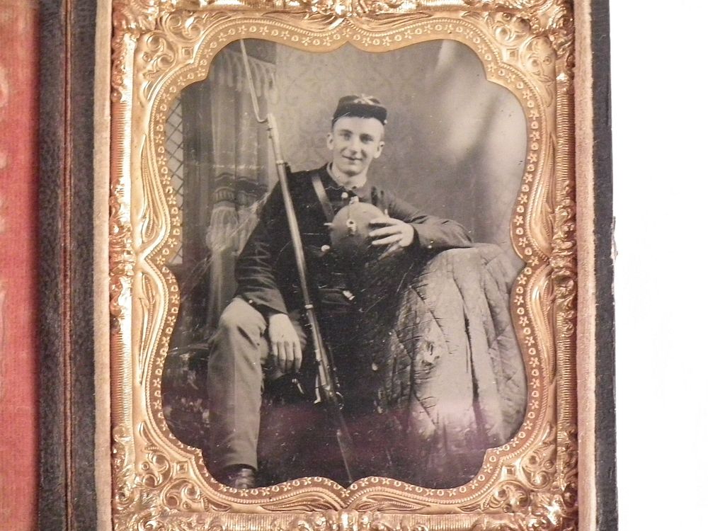 Appraisal: AMBROTYPE CIVIL WAR SOLDIER Fine ambrotype of a young smiling