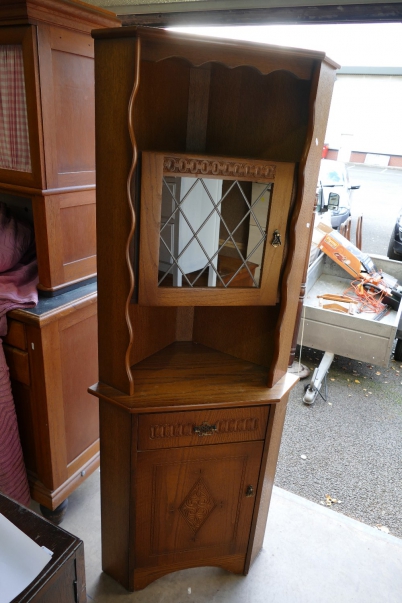 Appraisal: Carved oak corner cupboard with leaded glazed fitted unit