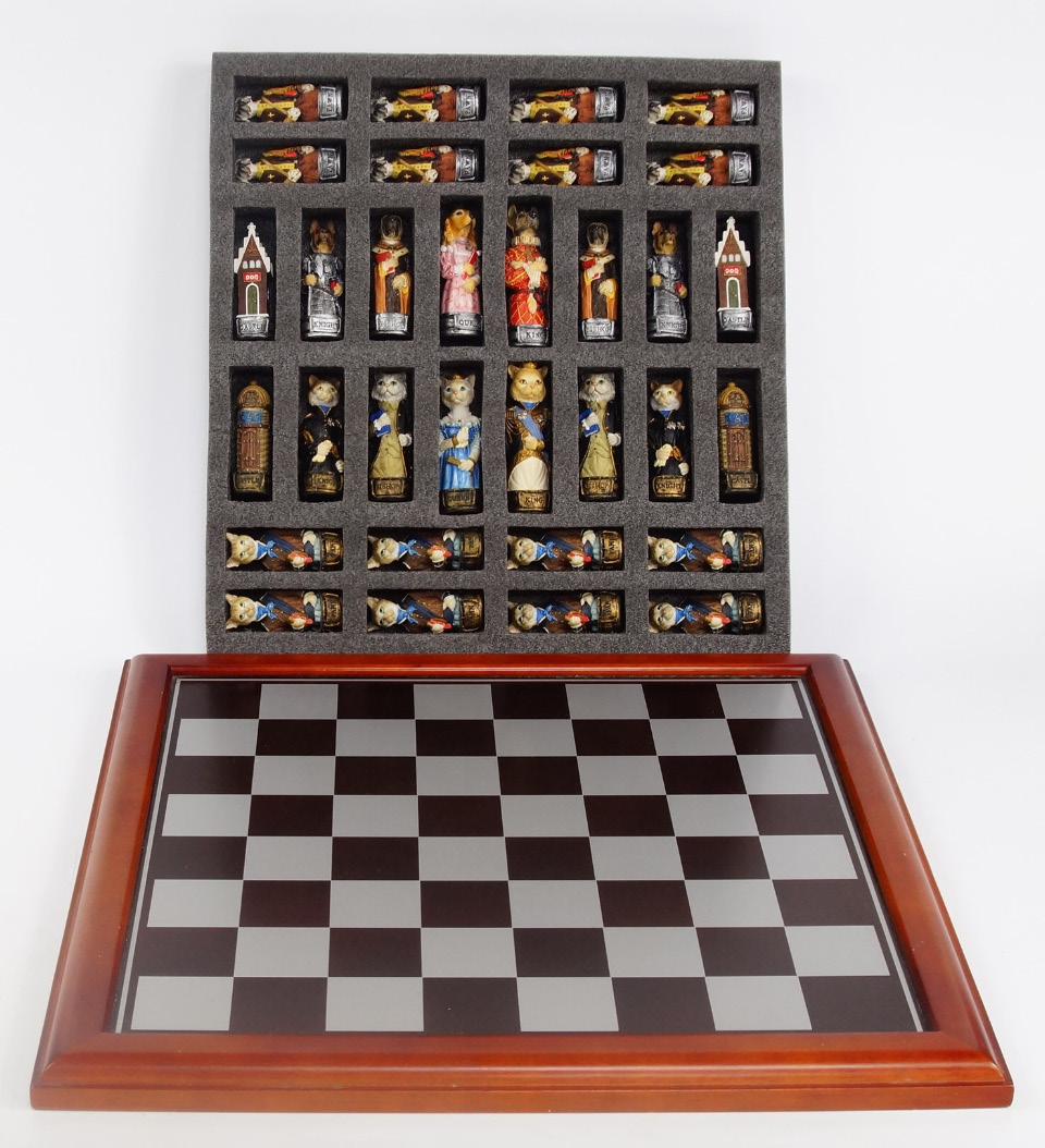 Appraisal: A Sigris plaster chess set modelled as cats and dogs