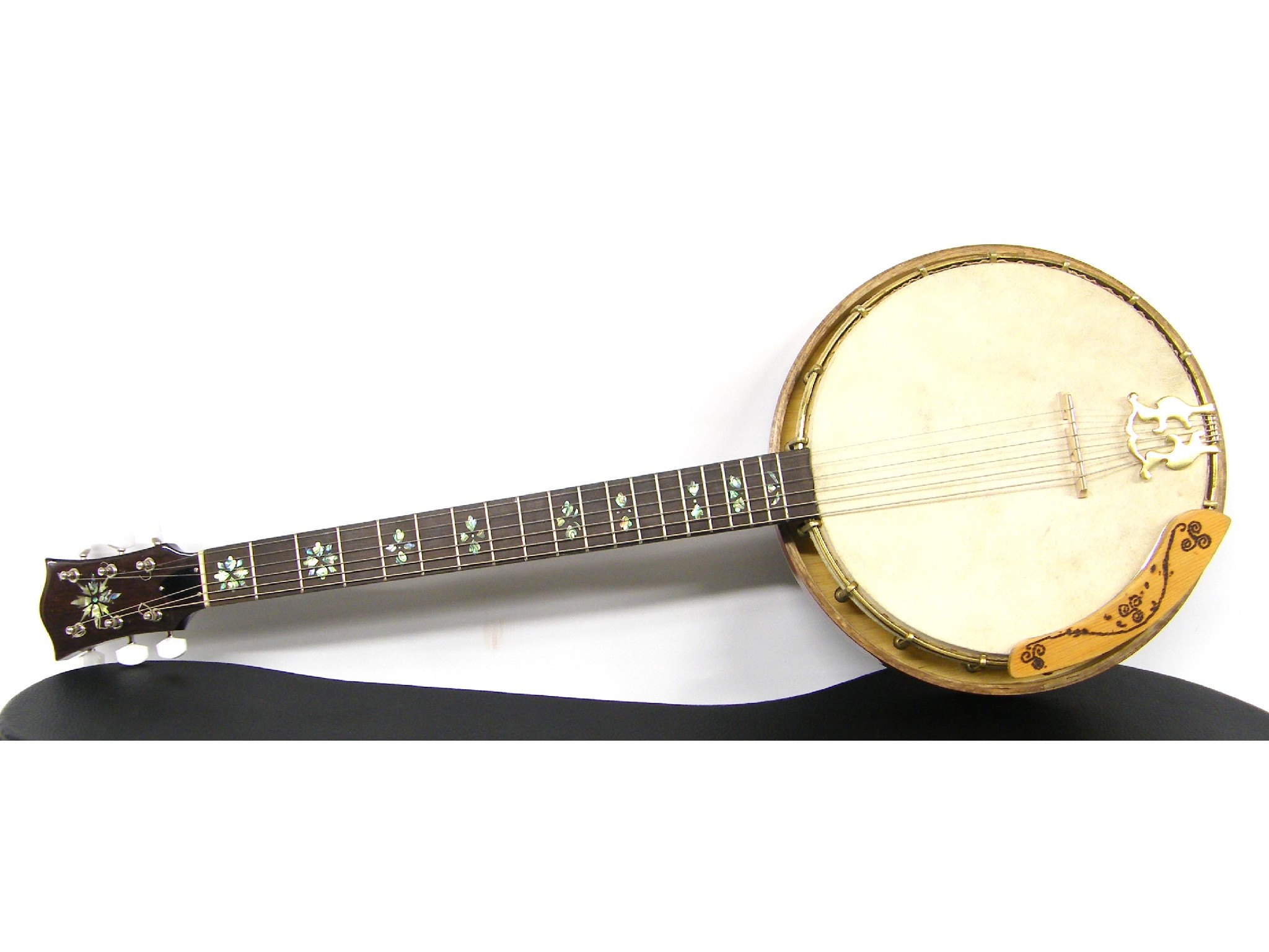 Appraisal: Contemporary decorative guitar banjo with heavily carved lower neck and