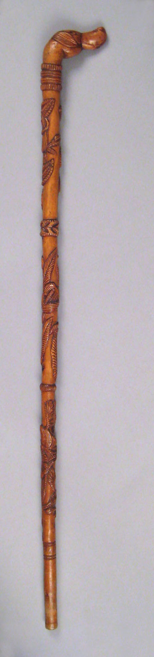 Appraisal: Carved cane late th c with hound head grip the