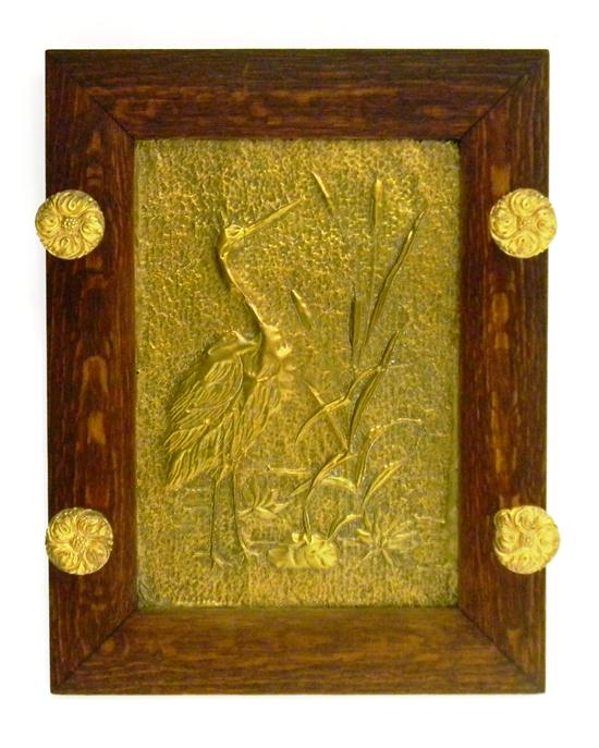 Appraisal: Aesthetic Movement hanging hall rack central brass repousse panel decorated