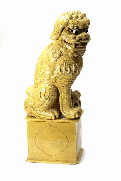 Appraisal: A Chinese yellow glazed pottery Fu lion with seperately constructed