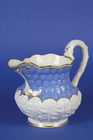 Appraisal: A ROCKINGHAM BLUE AND WHITE CABBAGE LEAF MOULDED JUG on