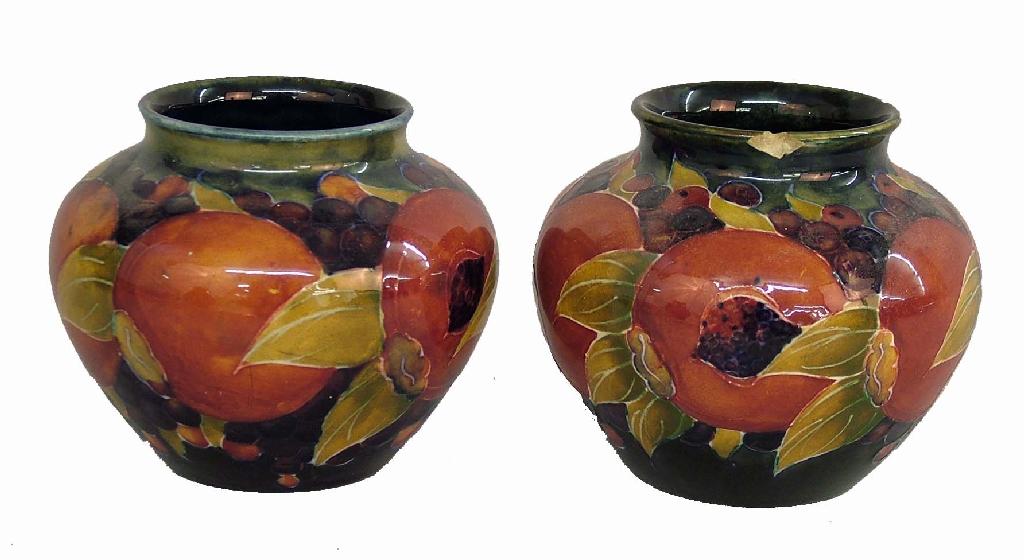 Appraisal: Pair of William Moorcroft 'Pomegranate' ovoid vases each with full