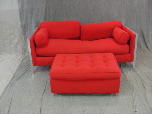 Appraisal: Red Sofa with Metal Arms together with an Ottoman Midcentury