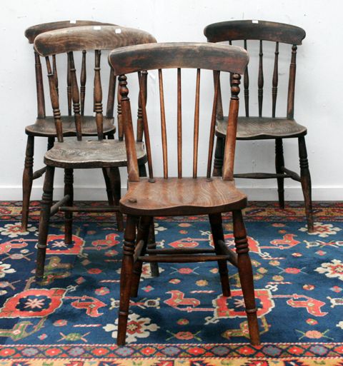 Appraisal: Four Windsor style dining chairs in ash and elm damage