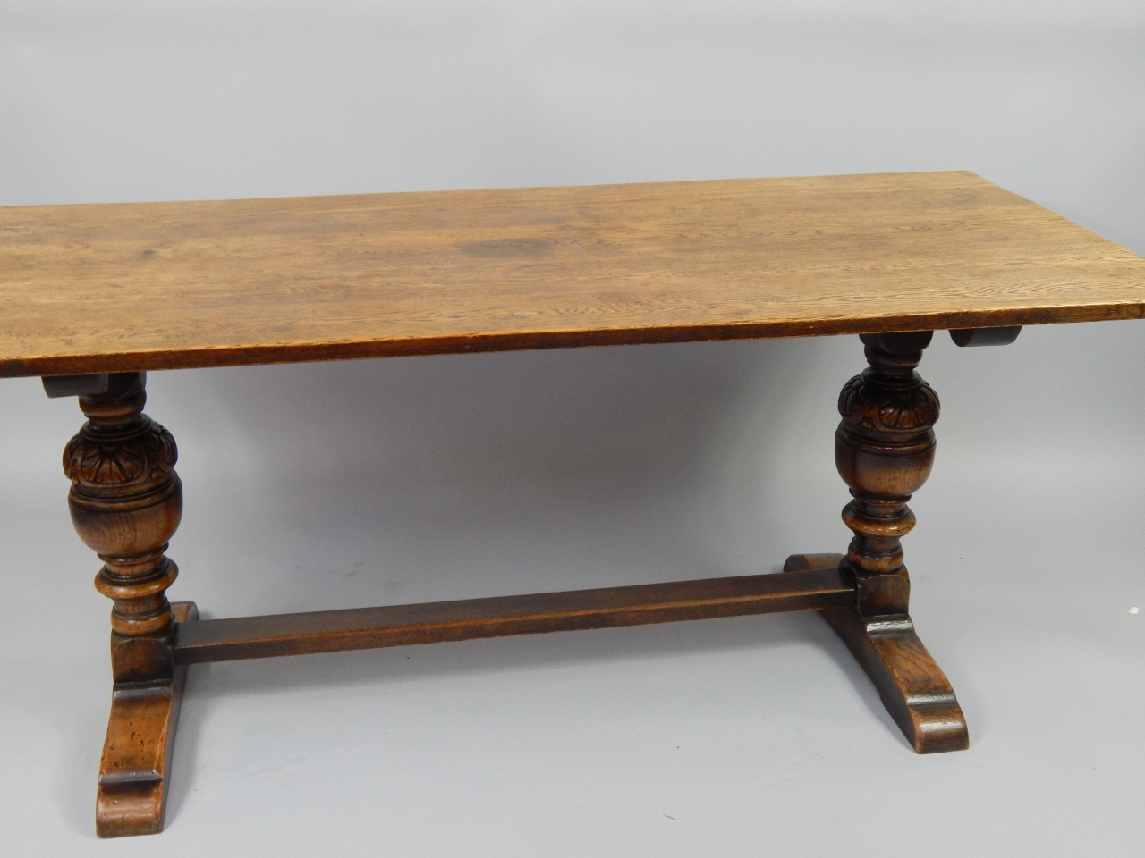 Appraisal: A Jacobean style oak refectory dining table raised on carved