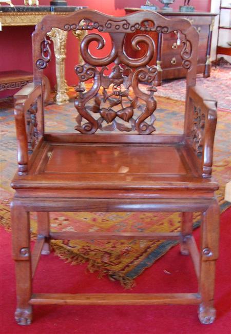 Appraisal: A pair of Chinese carved huang huali wood armchairs the