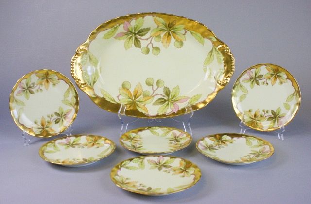 Appraisal: Limoges Platter and Matching Plates Hand painted gilt and leaf