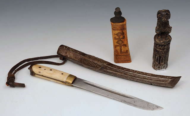 Appraisal: A TIBETAN DAGGER with bone handle and engraved scabbard an